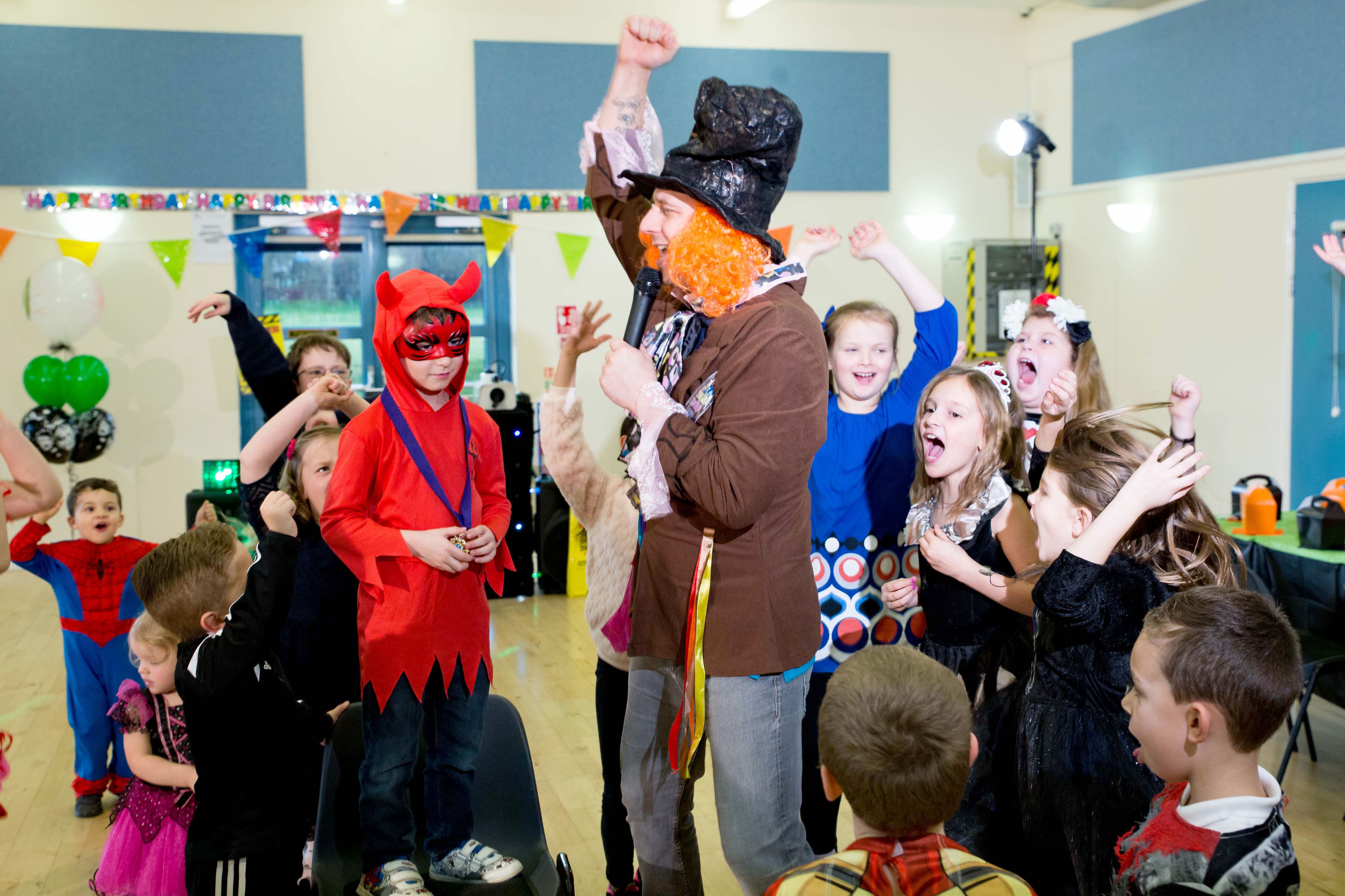 Halloween kids party with colourful costumes