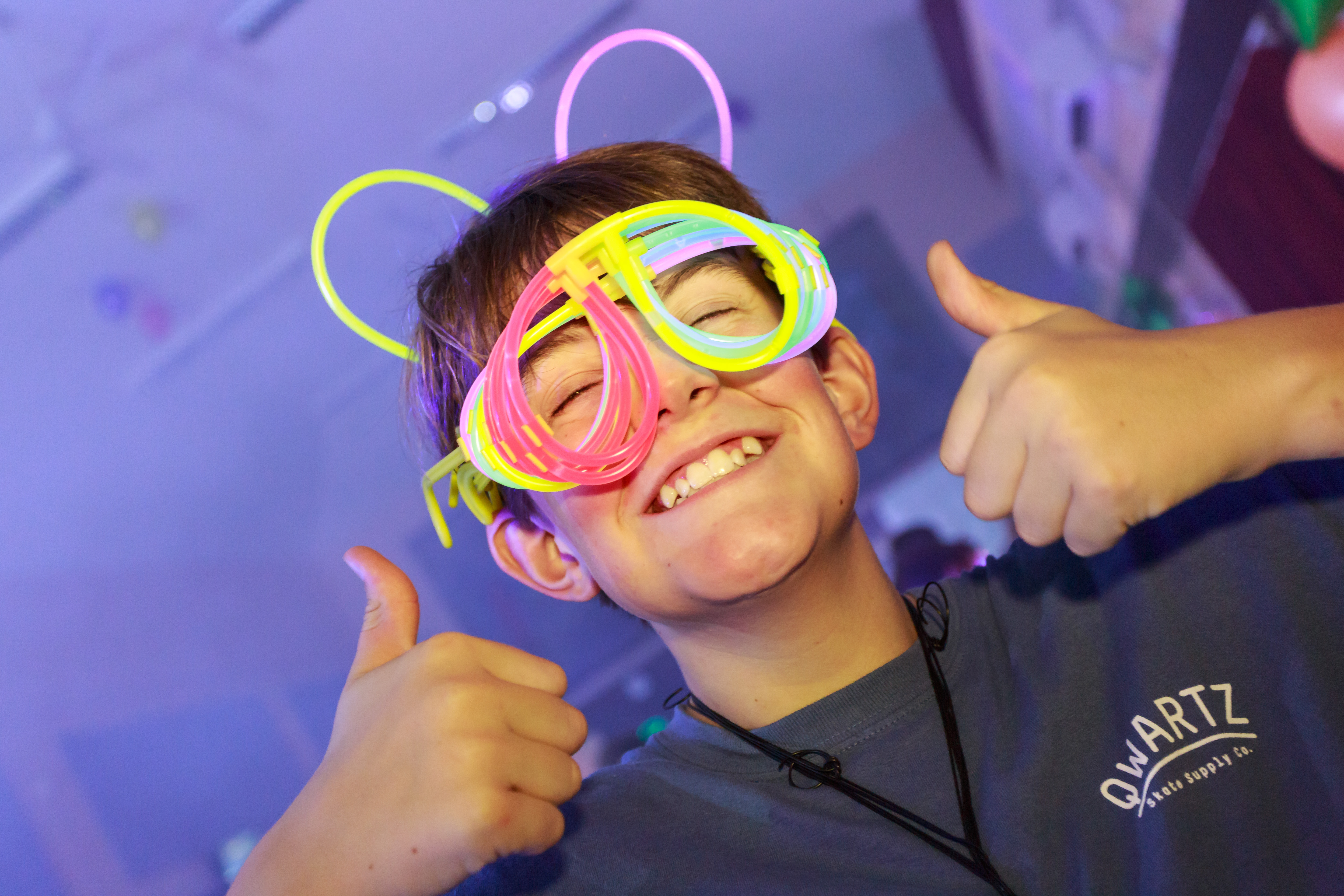 Child with neon glowstick glasses