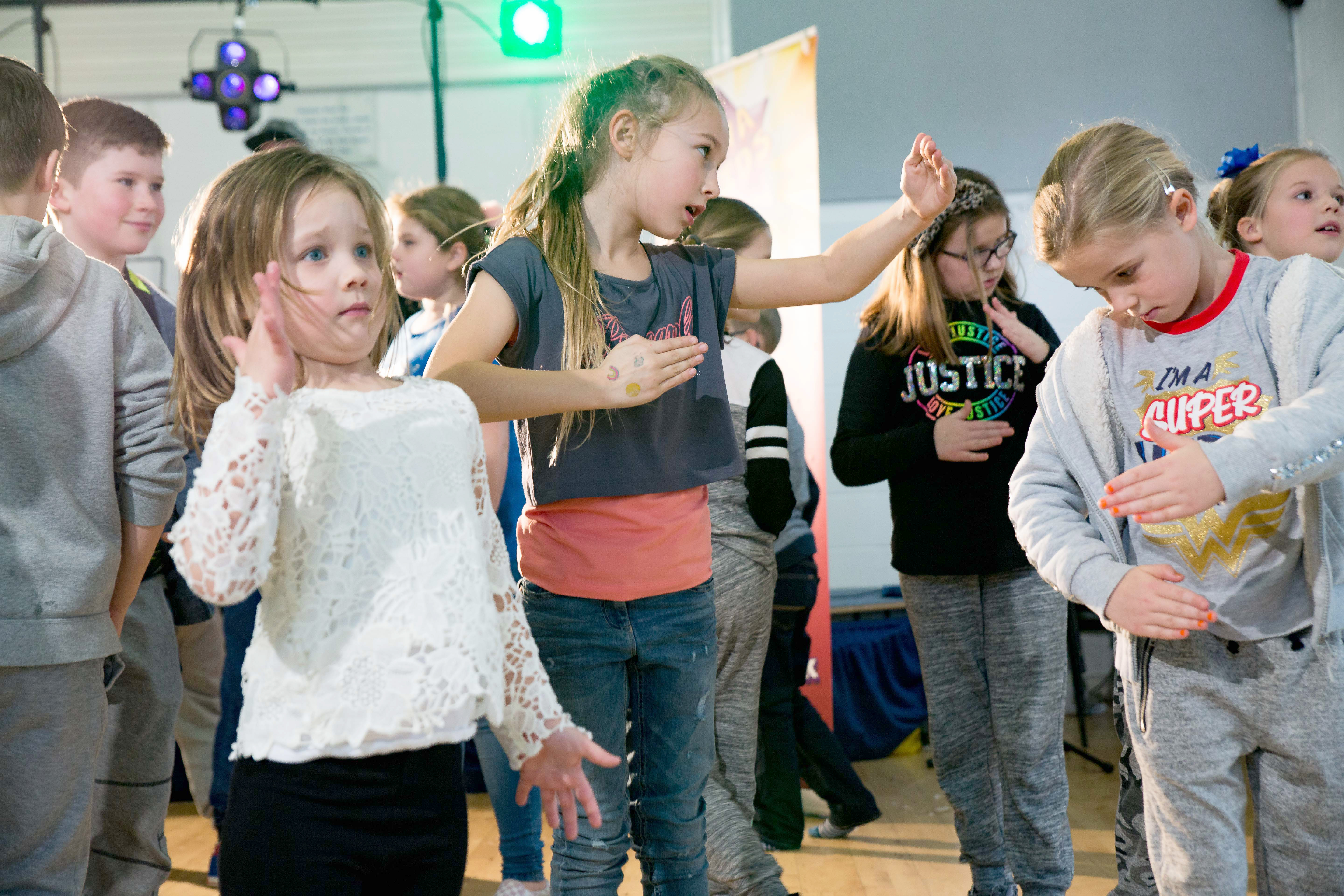 Group of children dancing like robots at a party